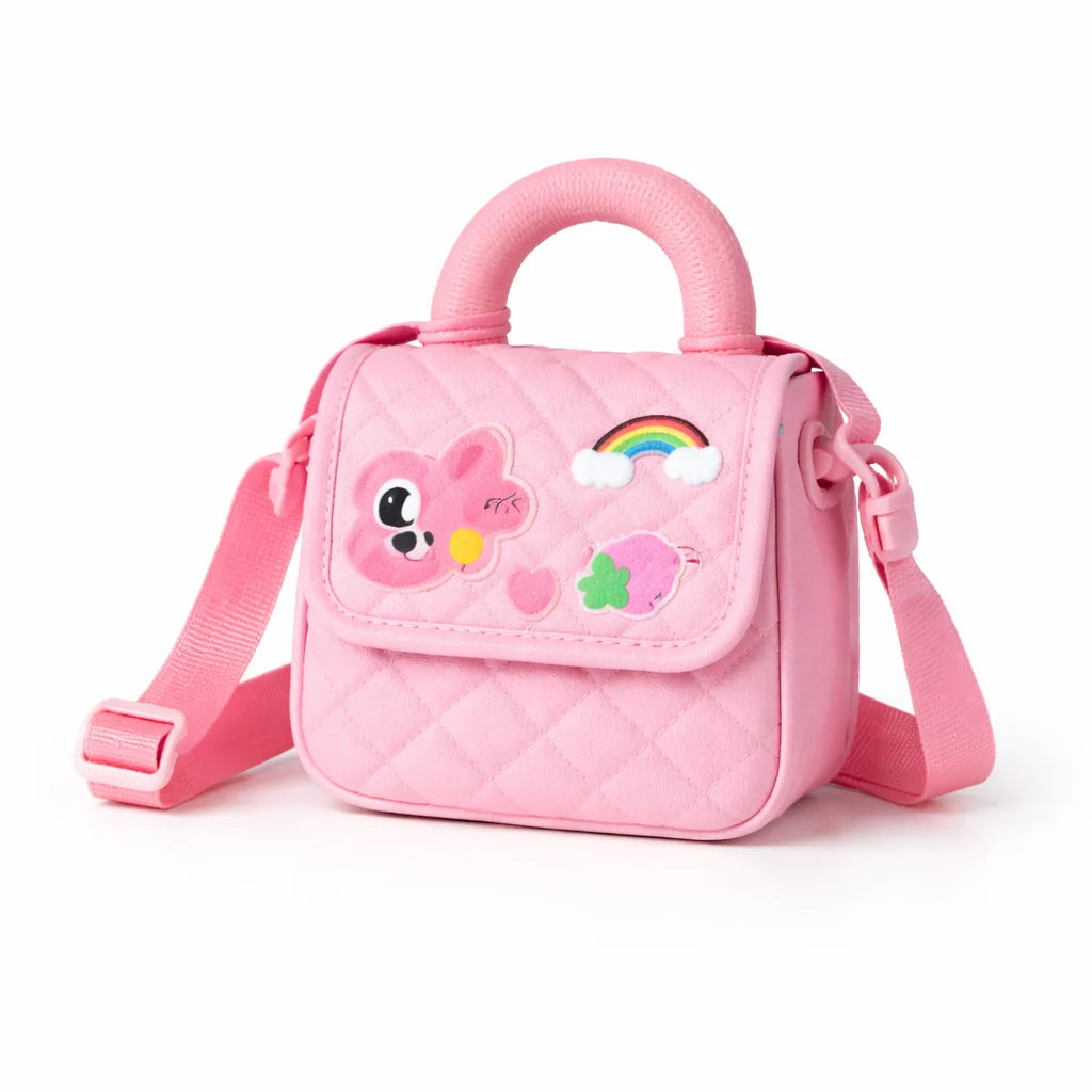 Pink children's bag with cartoon face and rainbow design on a white background